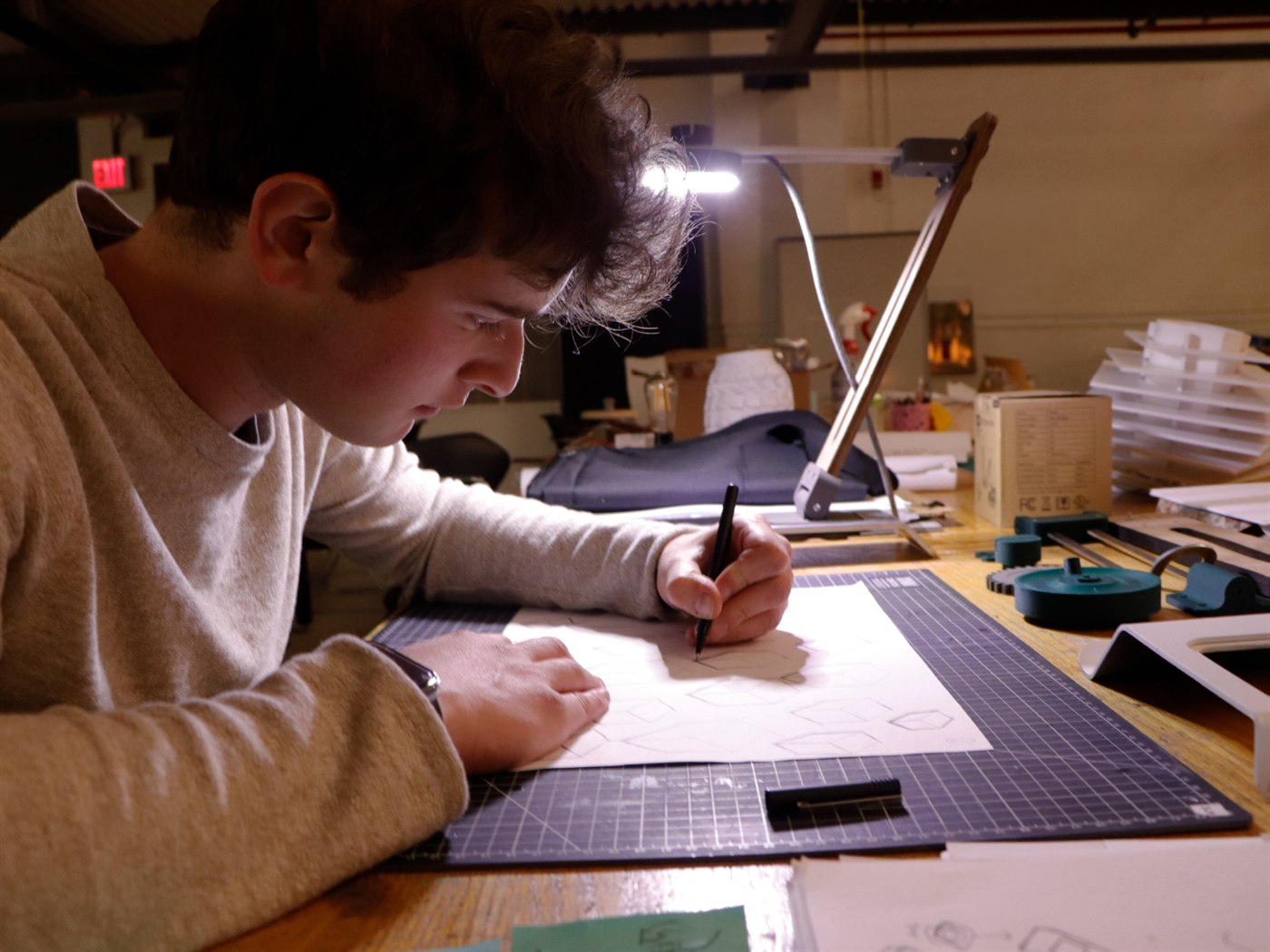 Sam Howard sketching in the studio